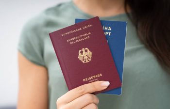 Woman Holding Two Passports.