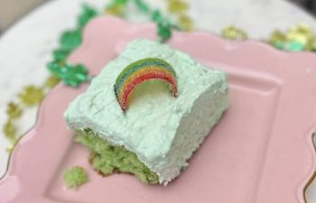 Green pistachio cake on pink plate
