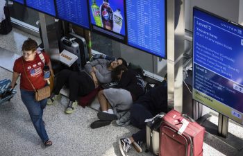 Delayed passengers sleep in airport terminal