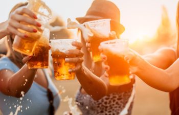 Friends toasting with beer