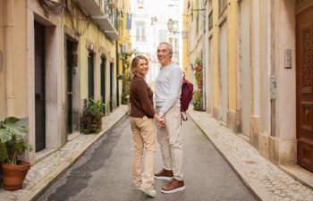 older couple walking in European city